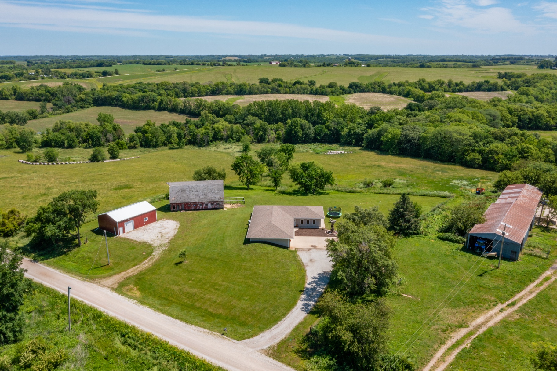 Aerial of the homestead with rolling hills and outbuildings