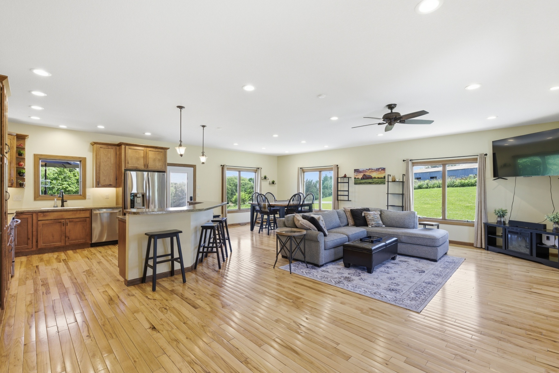 Open great room — kitchen, dining, and living