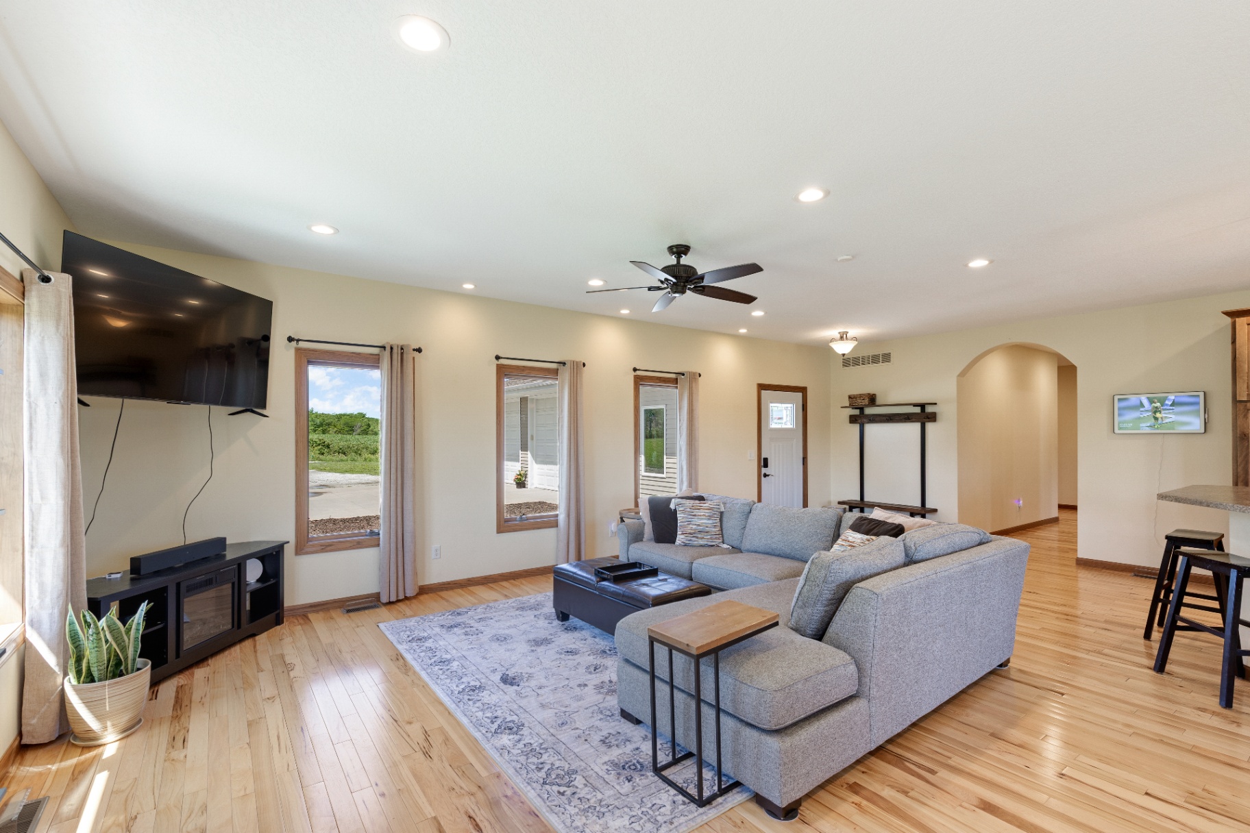 Living room with large sectional and front windows