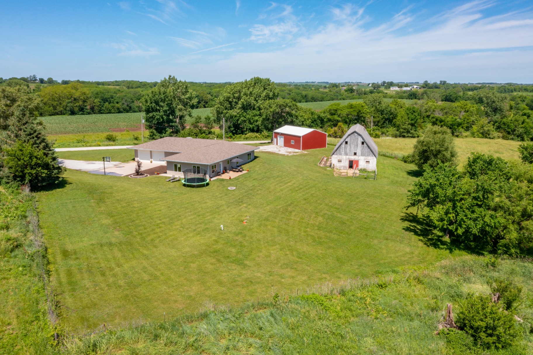 Two acres of mowed lawn and tree line