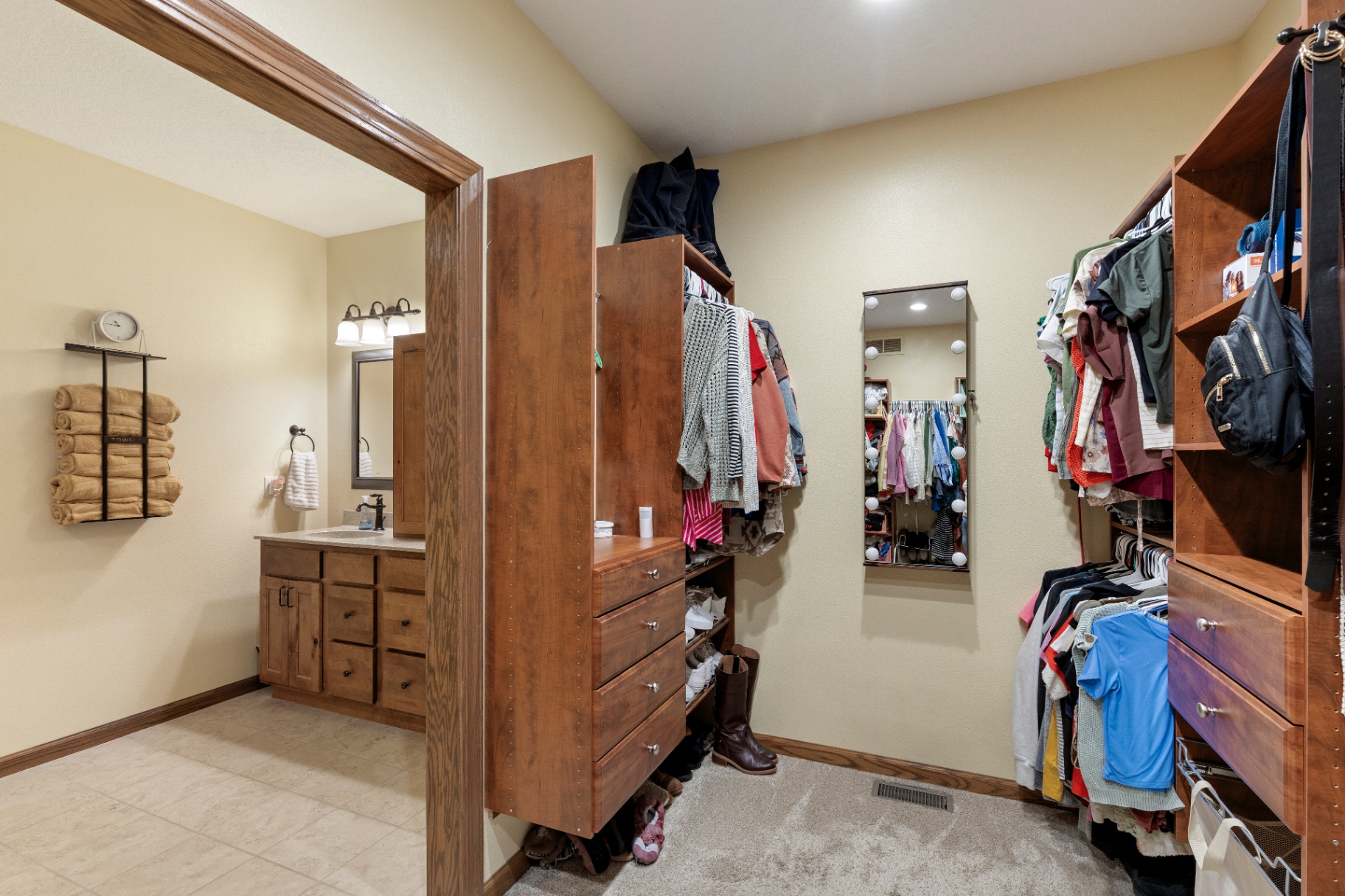 Dressing area between the primary closet and ensuite bath