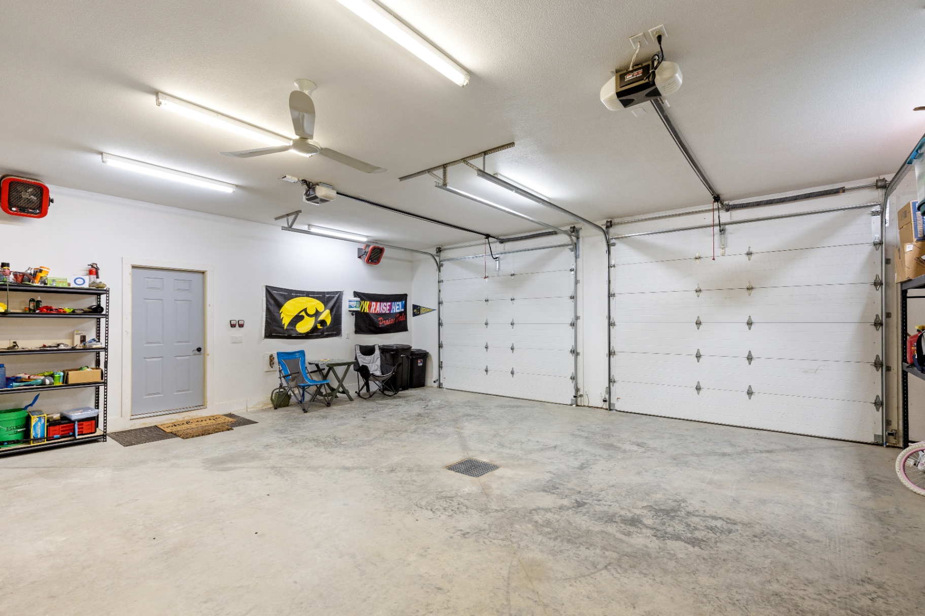 Wide view of the garage doors and finished interior
