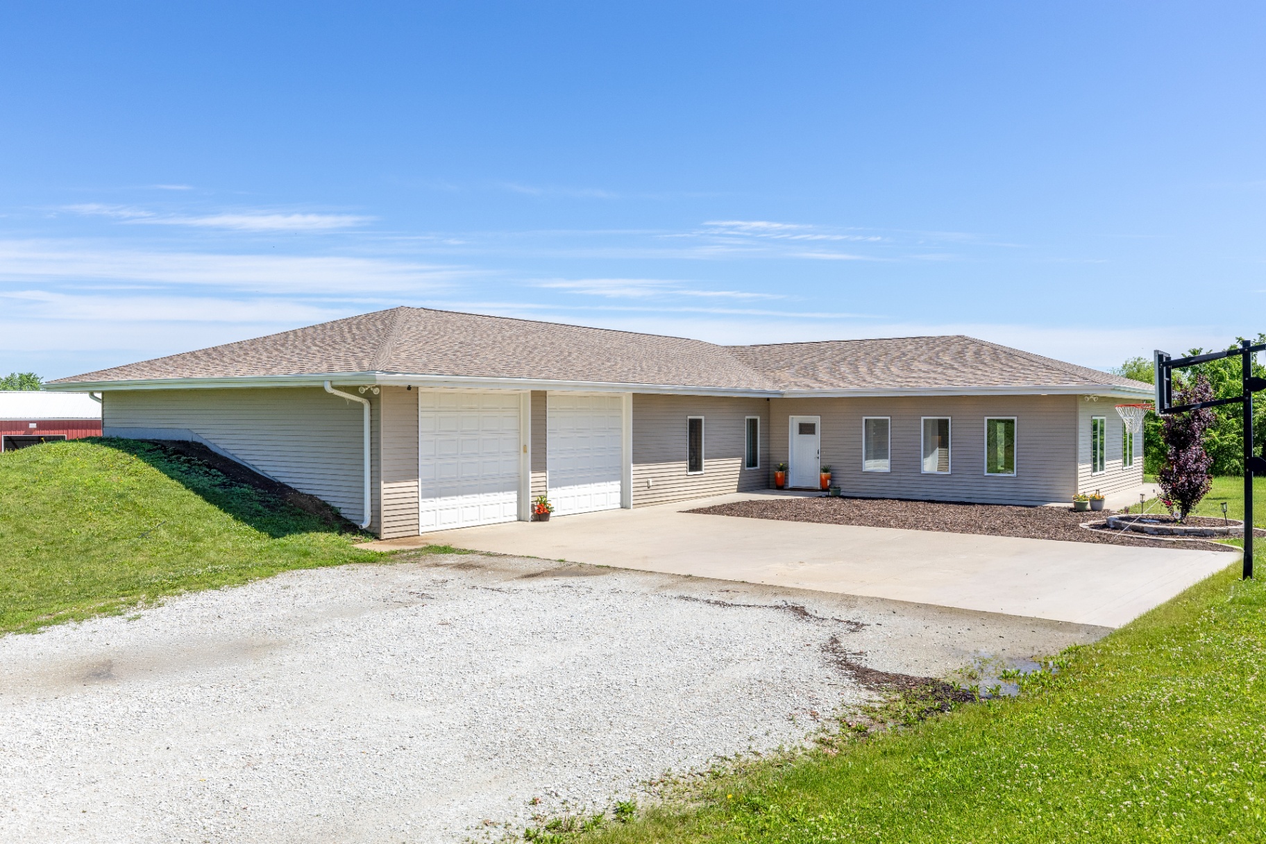Side view of the ranch with the barn in the distance