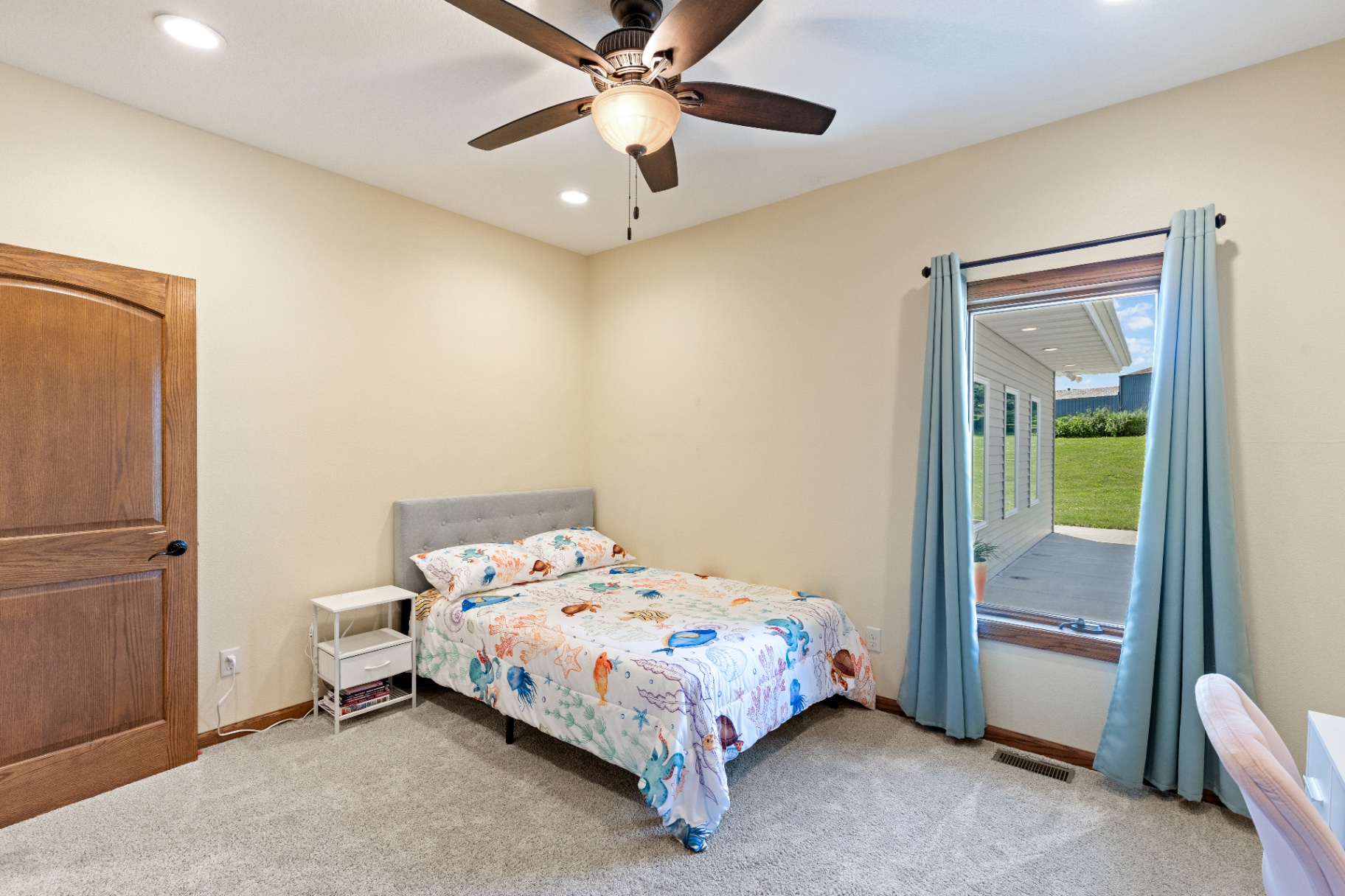 Guest bedroom with covered patio view