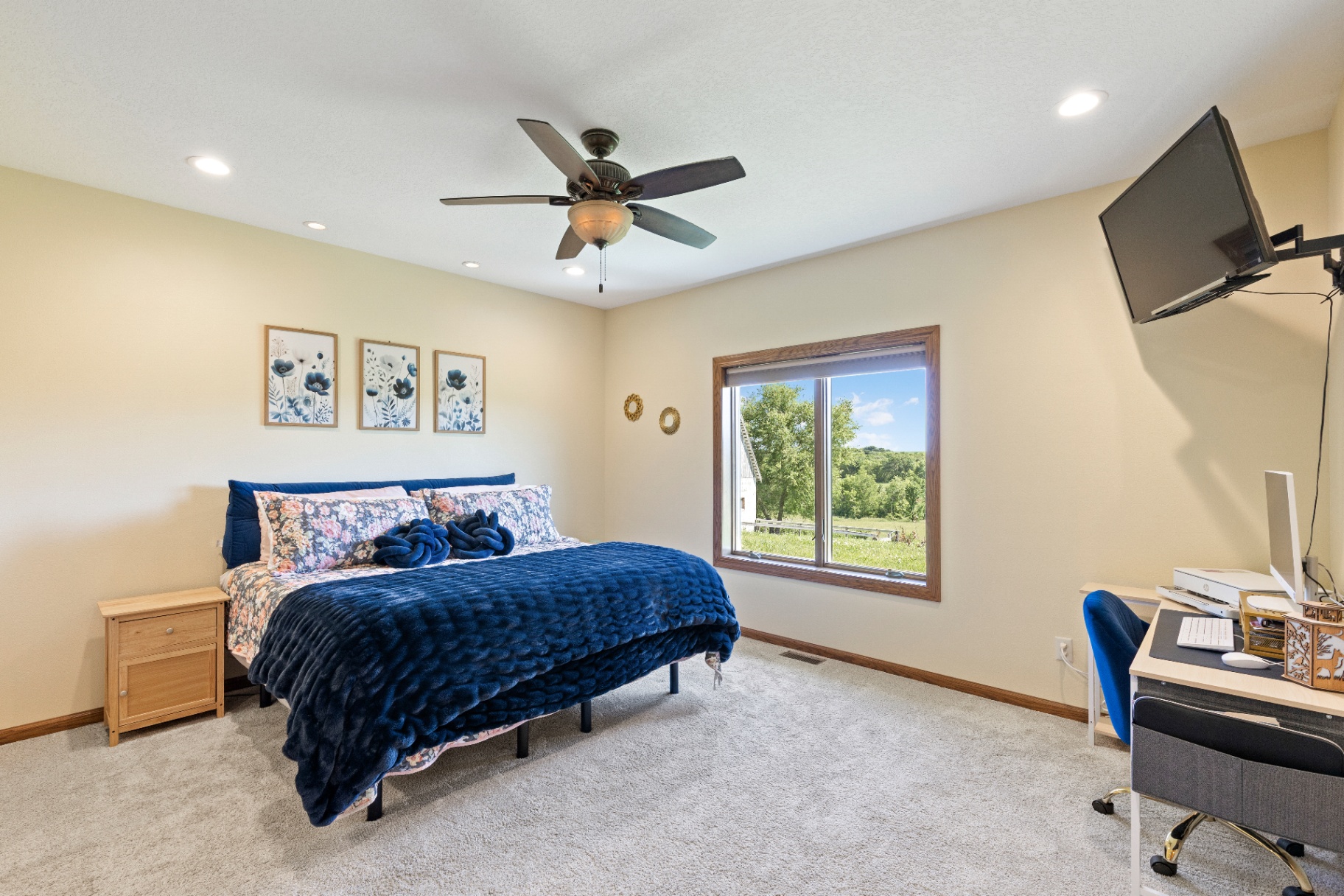 Primary bedroom with office nook and large picture window
