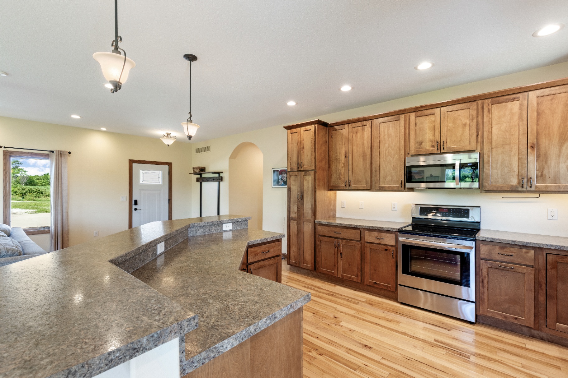 Custom kitchen with wood cabinetry and stainless appliances